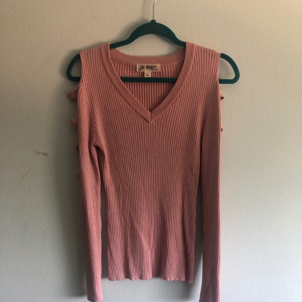 Blush pink ribbed sweater with ladder arm cutouts